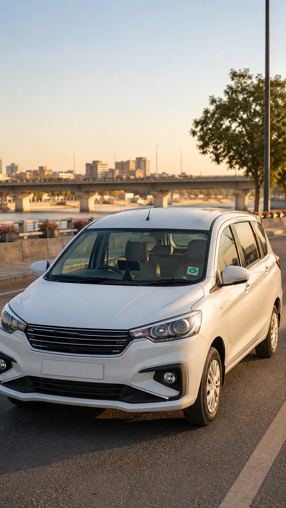 White Toyota Innova or Maruti Ertiga cab on a wide Ahmedabad road with a GPS device visible through the windshield and a modern flyover or the Sabarmati Riverfront in the background.
