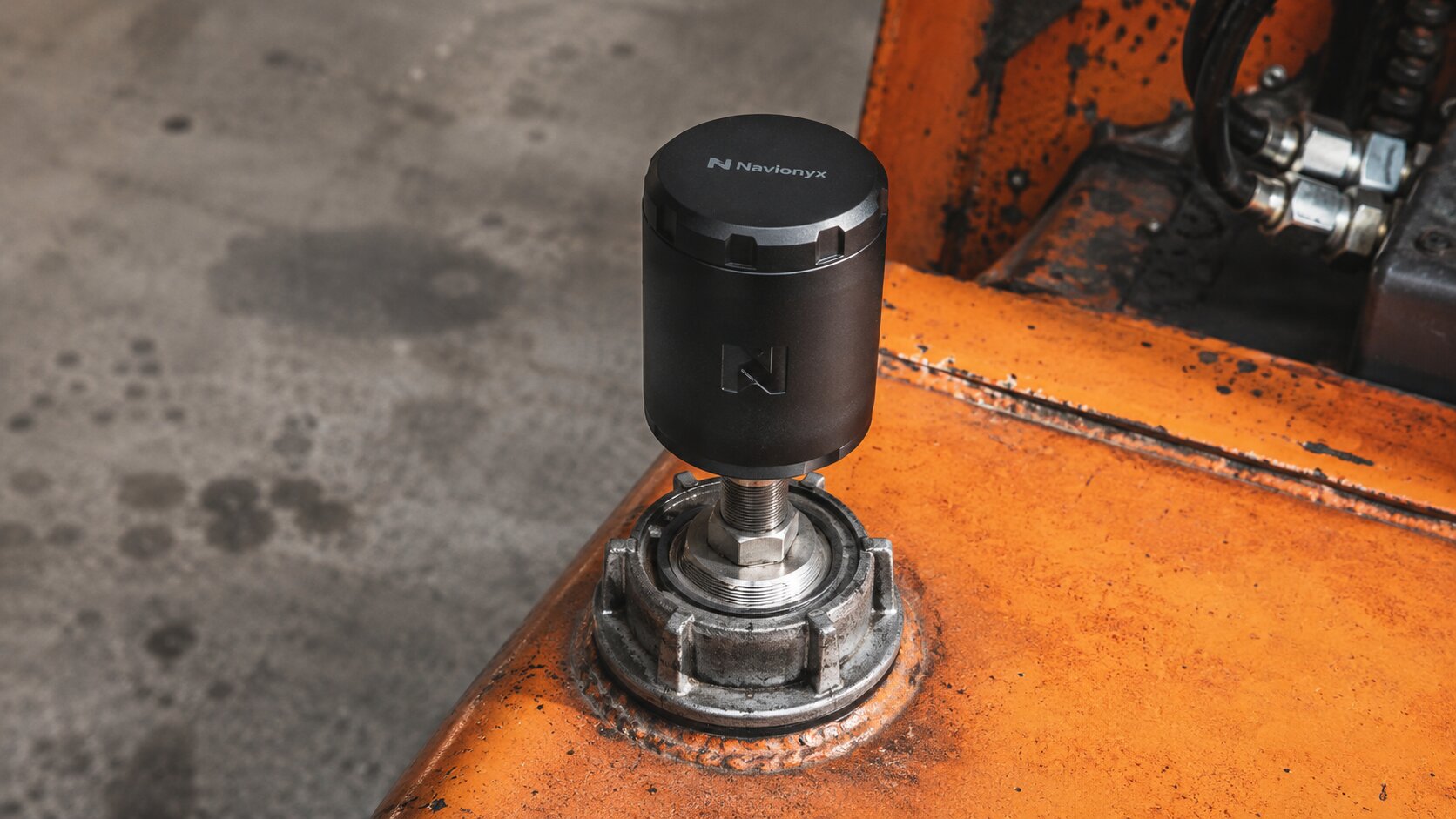 Navionyx BLE fuel sensor mounted on an industrial diesel tank for real-time generator fuel monitoring.